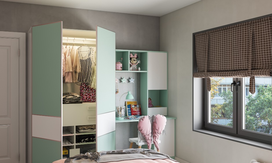 Girls bedroom design with a study table with an attached wardrobe for storage kids essentials
