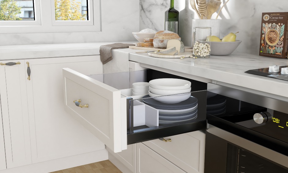 Modular kitchen design in l shaped style with pull out drawers to store kitchen essentials