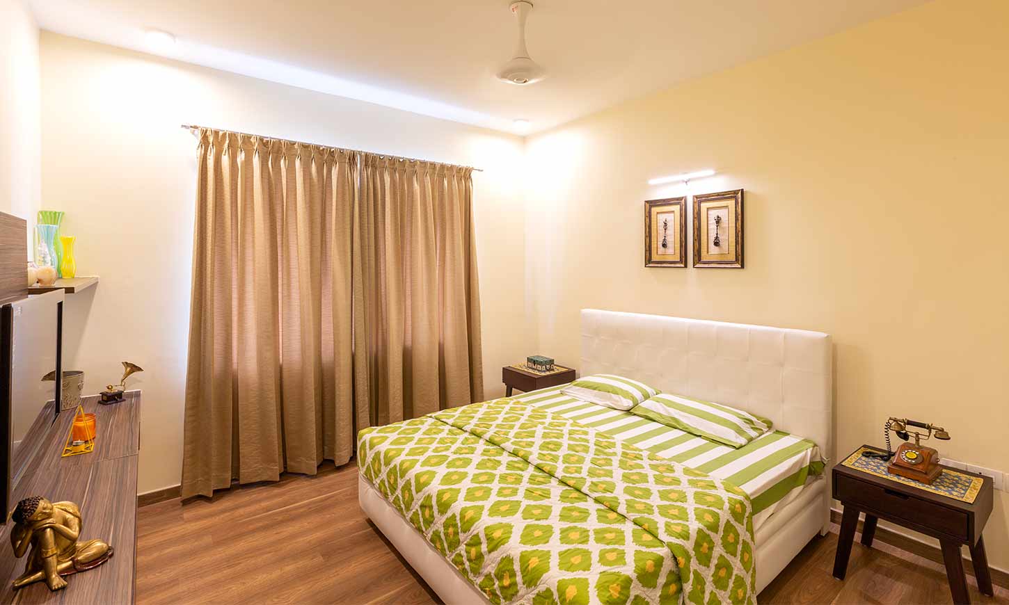 Top interior decorators in bangalore for green bedroom with white bed